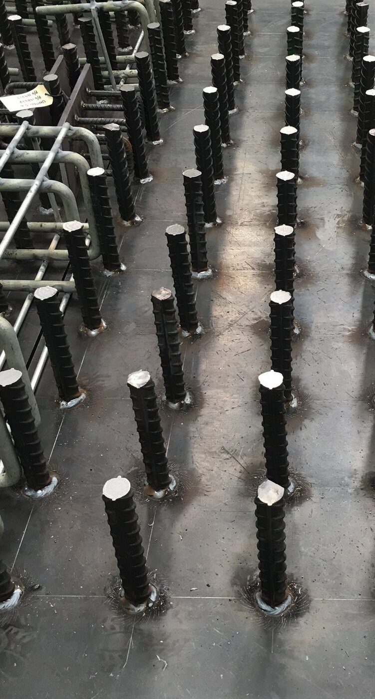 Cast-in plates for pre-cast concrete